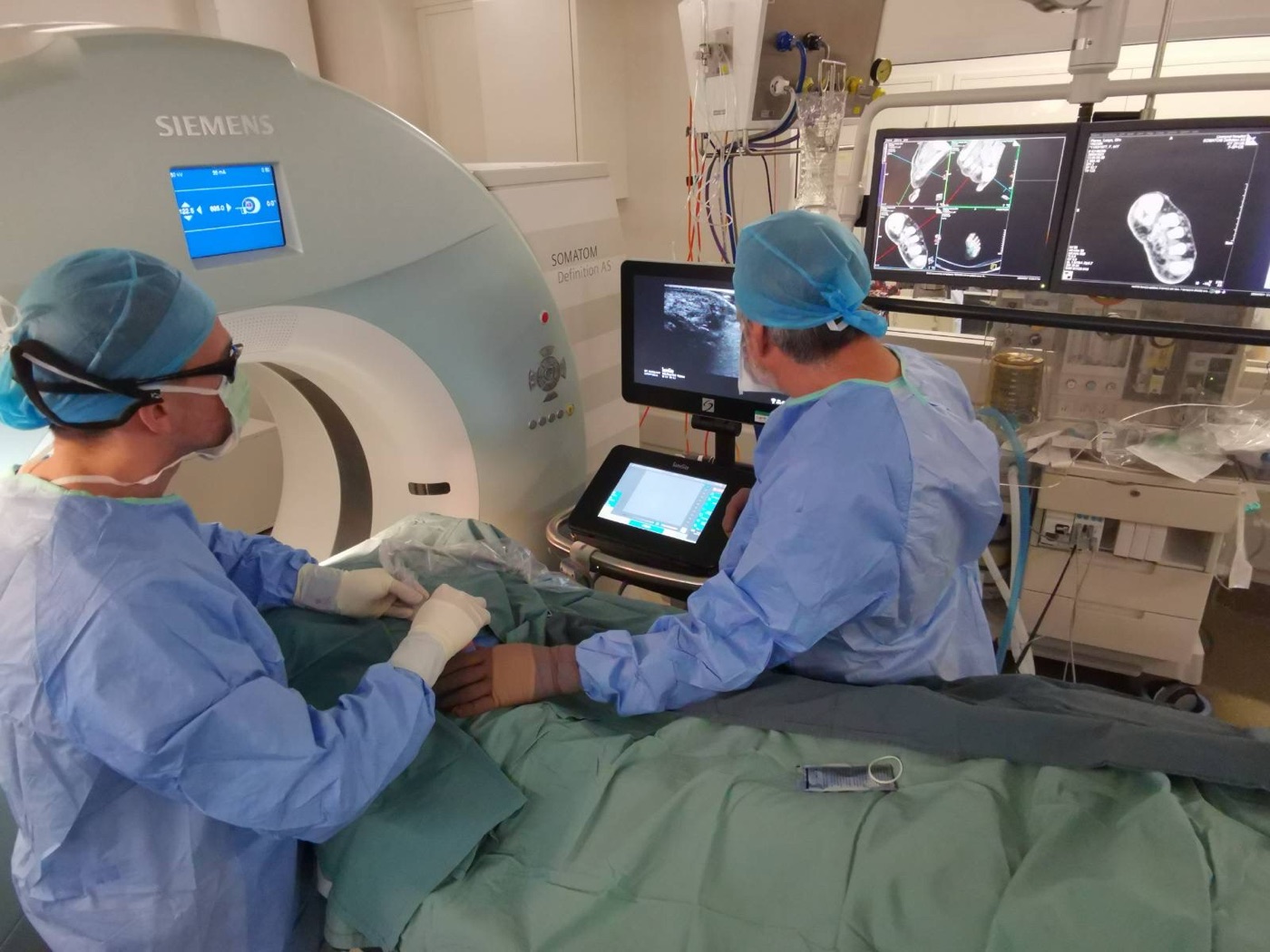 Dr Glen Schlaphoff and Dr Hannah Ireland performing CT-guided cryoablation of a Morton's neuroma